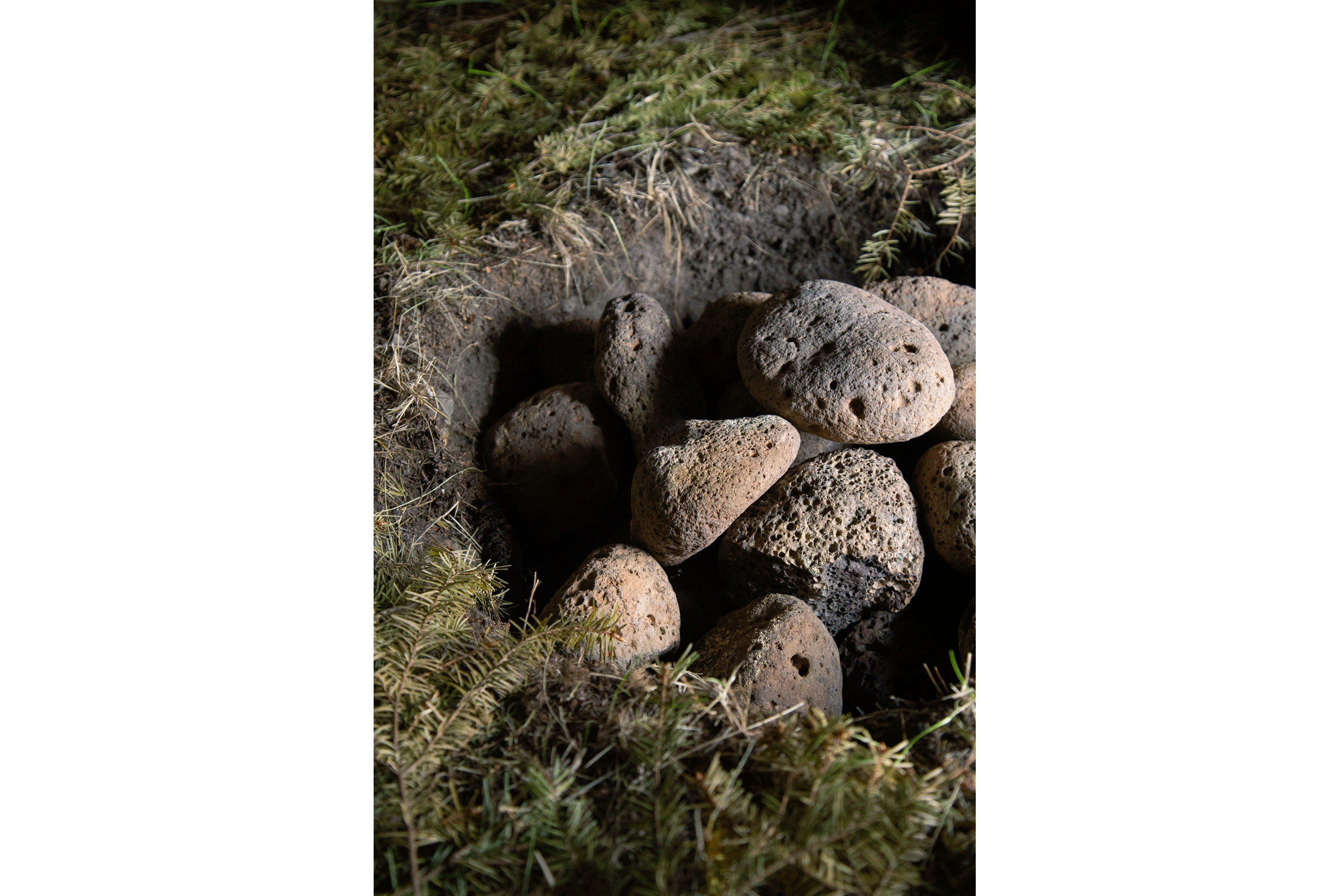 Lava stones in the middle of the sweat lodge for smoking.